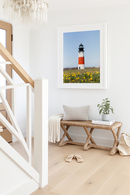 Color fine art photograph of Sankaty Head Lighthouse on Nantucket Island with yellow daffodils in soft focus in the foreground — spring wall art from Siasconset, Nantucket