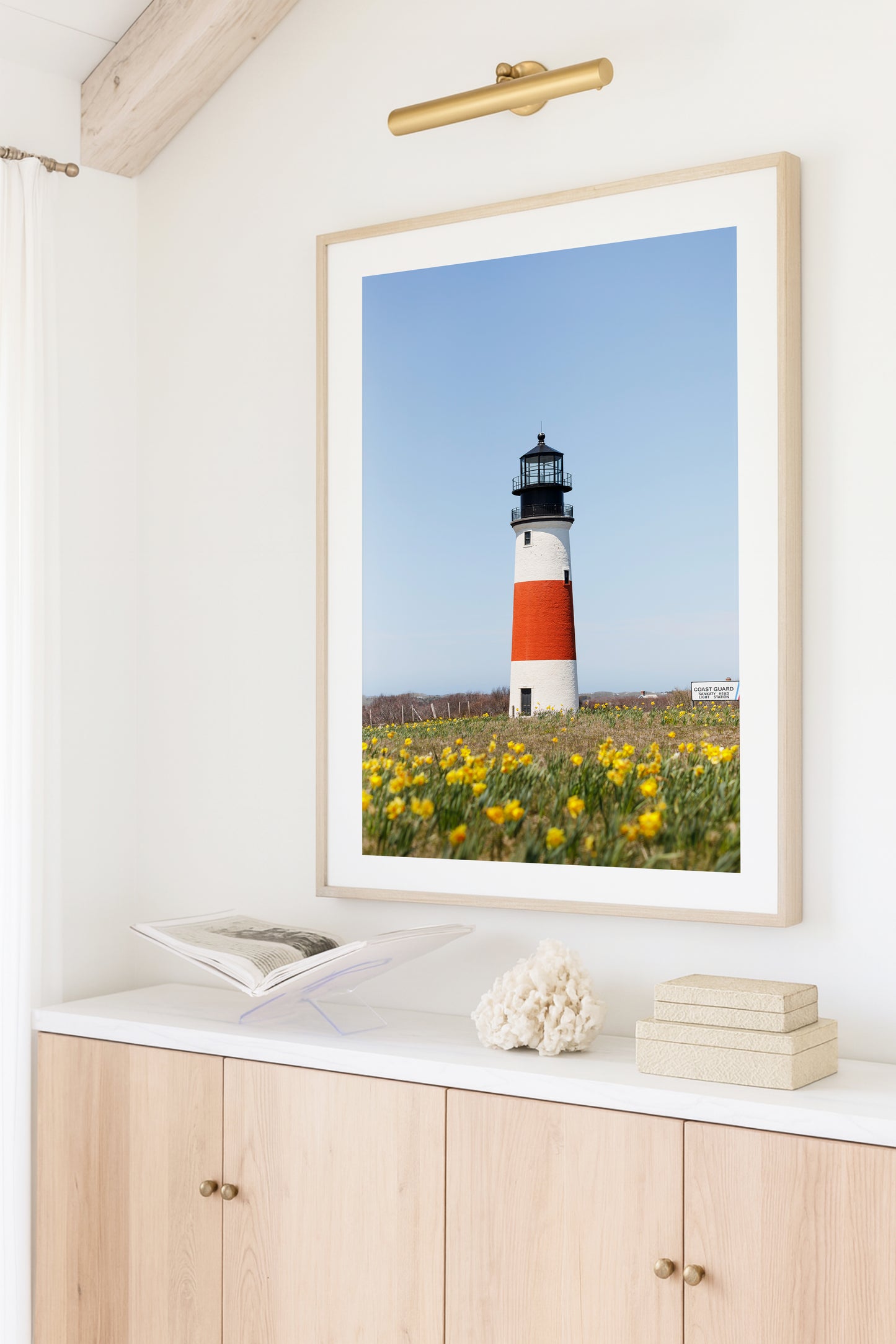Color fine art photograph of Sankaty Head Lighthouse on Nantucket Island with yellow daffodils in soft focus in the foreground — spring wall art from Siasconset, Nantucket