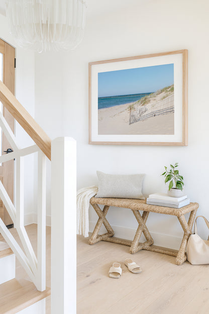 Horizontal beach photography print of Steps Beach on Nantucket Island with sand dunes, beach fencing, and blue ocean water.