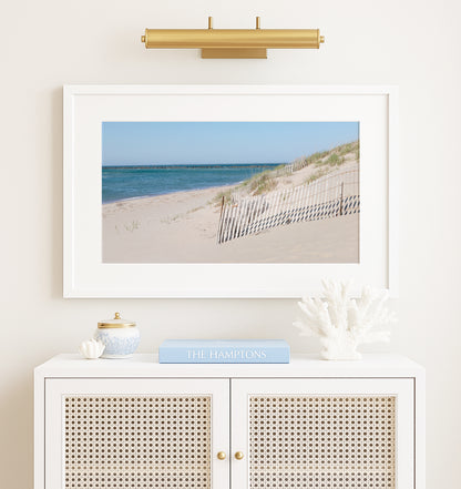 Horizontal beach photography print of Steps Beach on Nantucket Island with sand dunes, beach fencing, and blue ocean water.