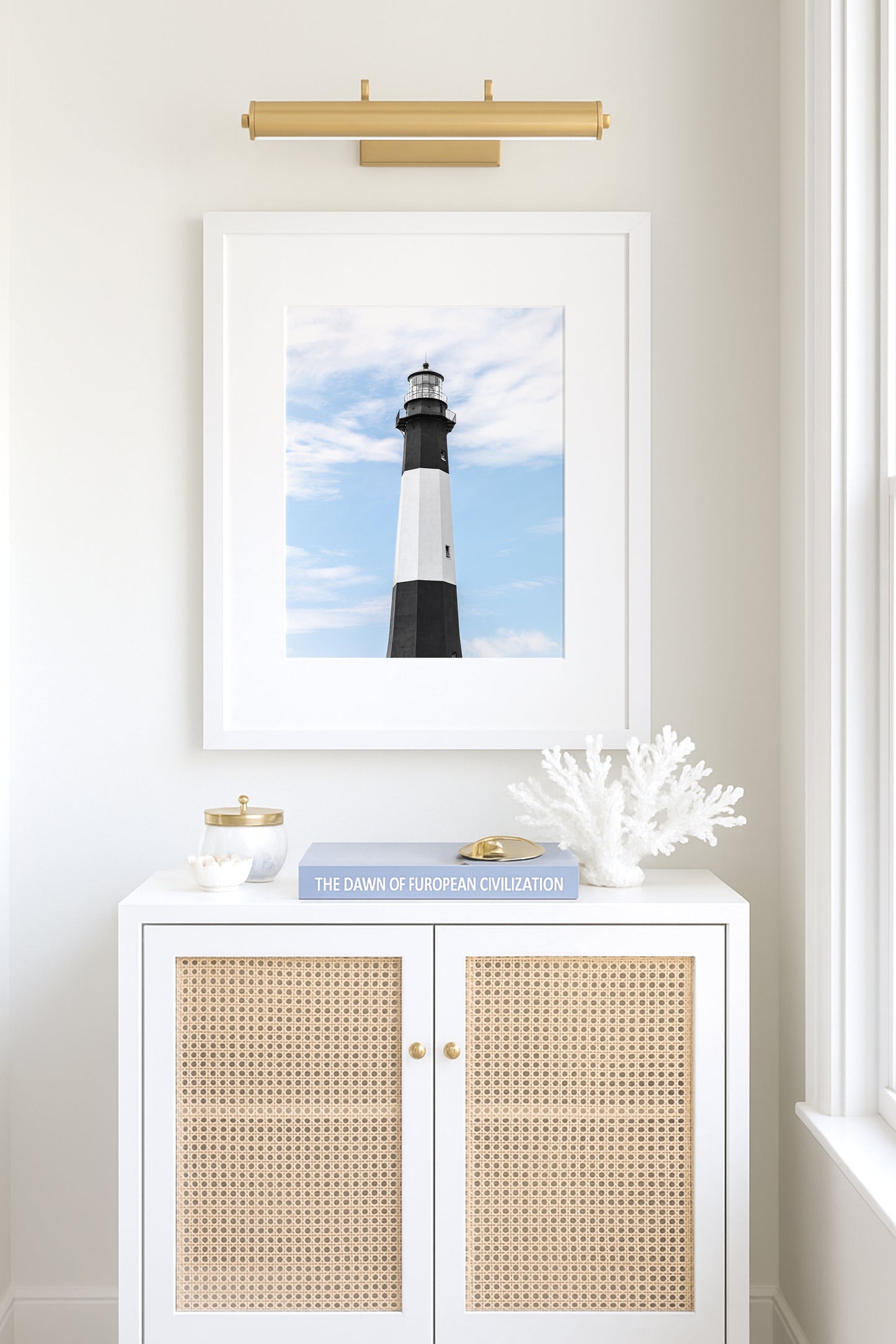 Fine art photograph of Tybee Island Lighthouse near Savannah, Georgia black and white striped tower against a soft blue sky, shot from below looking up