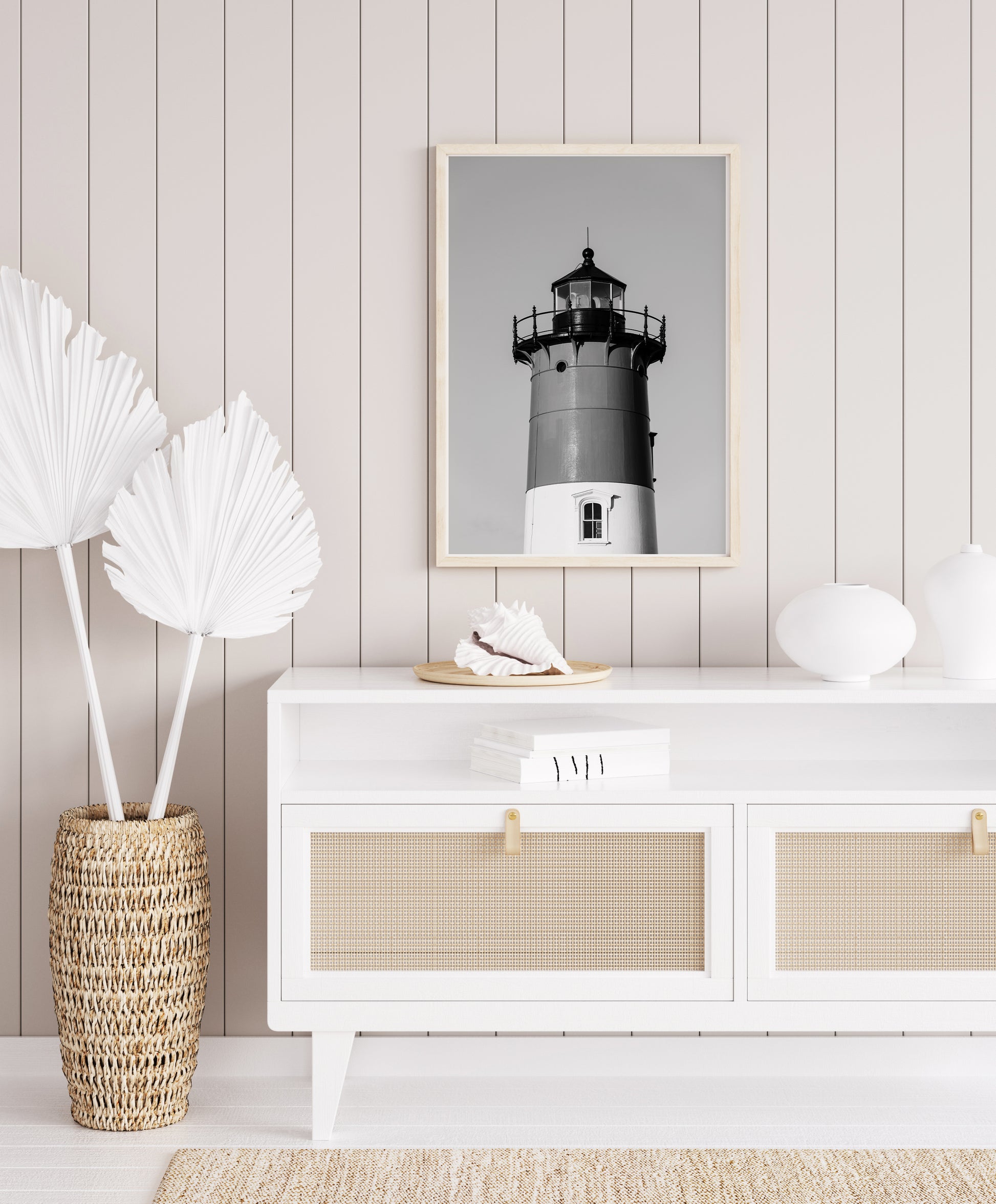 Black and white photograph of Nauset Lighthouse in Eastham, Massachusetts, featuring the iconic tower set against a pale sky. A minimalist coastal print ideal for Cape Cod–inspired decor and nautical wall art.