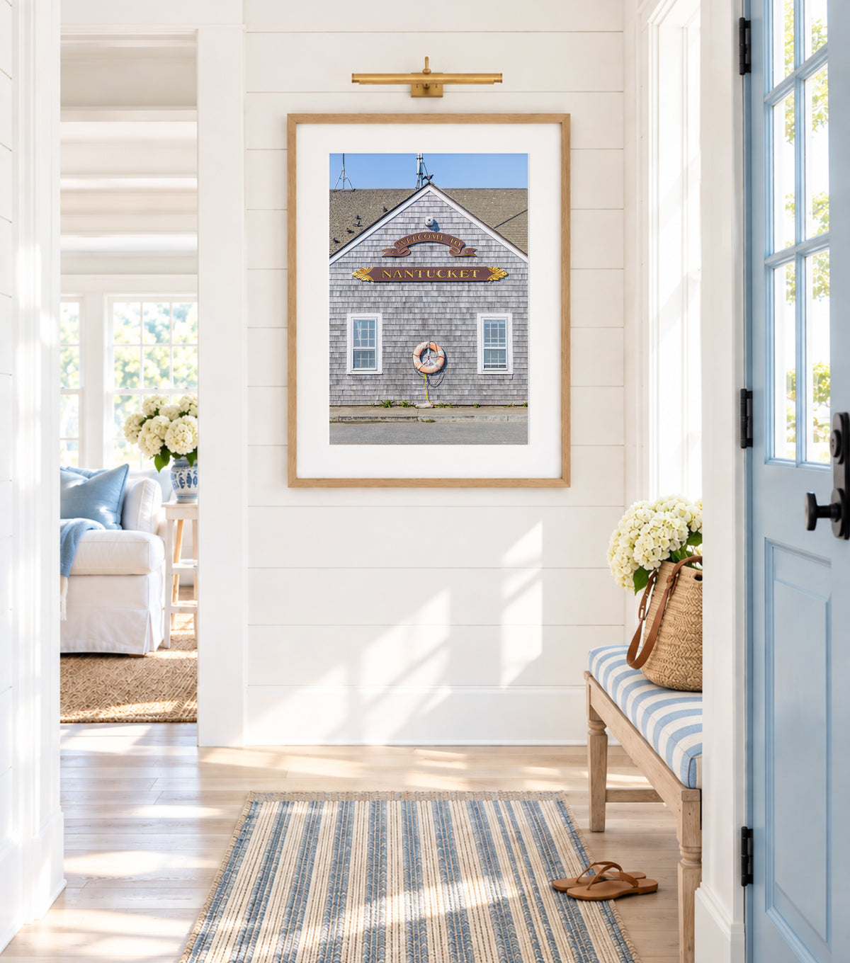 Welcome to Nantucket sign photography print — grey shingle building at Straight Wharf with gold lettering and life ring, Nantucket island wall art for beach house, cottage, or as a gift