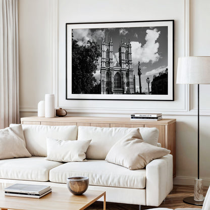 Black and white photograph of Westminster Abbey in London featuring detailed gothic architecture under a cloudy sky